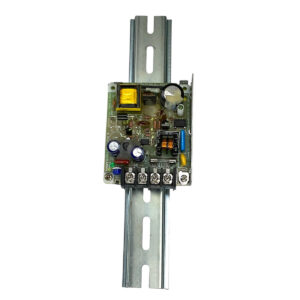 Fortress Pinpoint Power Supply on metal DIN rail with visible components and connection terminals.