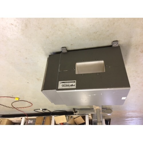 Fortress Technology Head Only 8" x 4" mounted on a wall above assorted cables and boxes.
