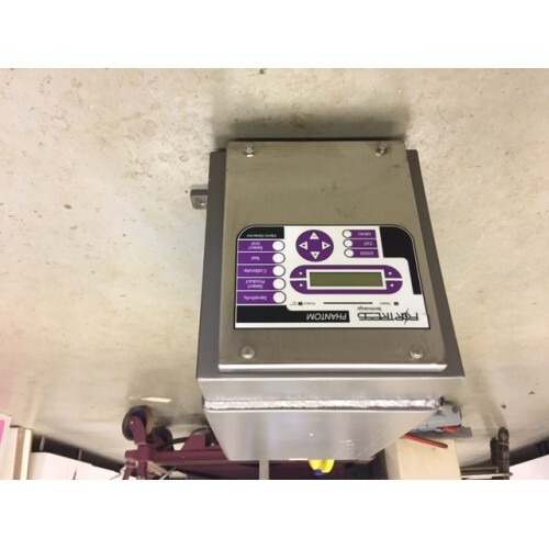 Fortress Technology Head Only 8" x 4" with digital display and purple buttons mounted on a wall.