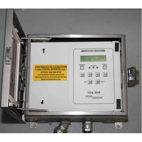 Goring Kerr DSP1 Metal Detector Head with display, buttons, and calibration sticker inside the metal enclosure door.