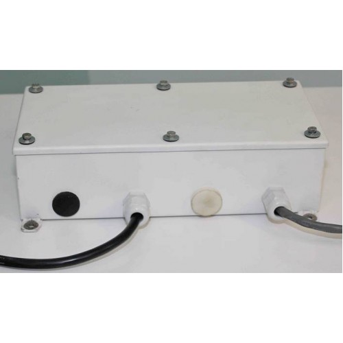 A Goring Kerr DSP1 Metal Detector Head, rectangular and white, with screws on top and two black cables in front ports.