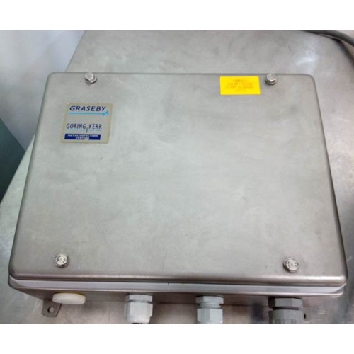 A Goring Kerr DSP2 Pipeline Metal Detector 4" rests on metal, featuring several cable connectors.