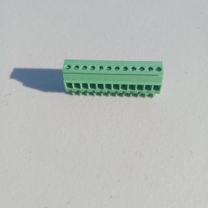 A Pluggable Terminal Blocks 12 Position connector with multiple wire slots is shown on a white surface.