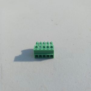 Pluggable Terminal Blocks 5 Position, green, on a white surface under direct light.