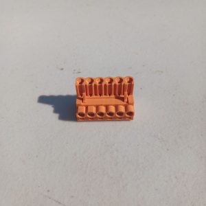 A Pluggable Terminal Blocks 6 Position sits on a white surface in bright sunlight.