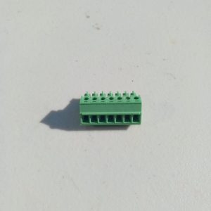 A Pluggable Terminal Blocks 7 Position sits on a white surface with its shadow visible to the left.